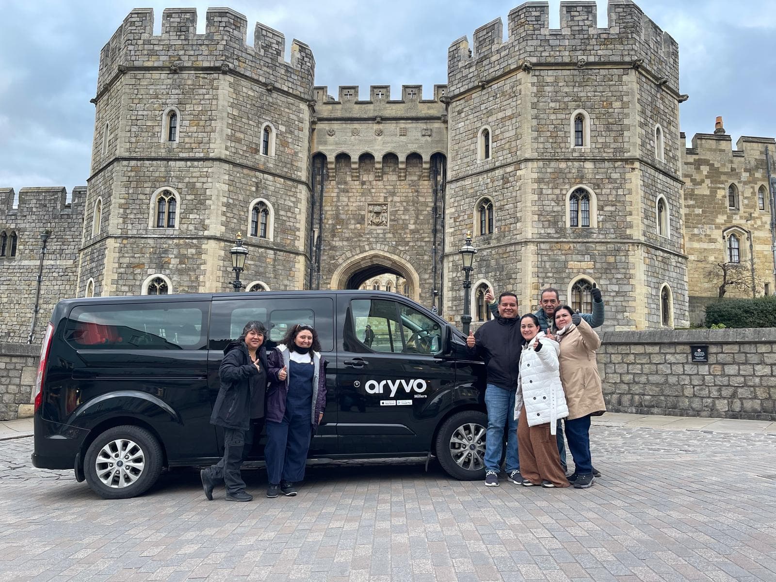 Driver with passenger in taxi